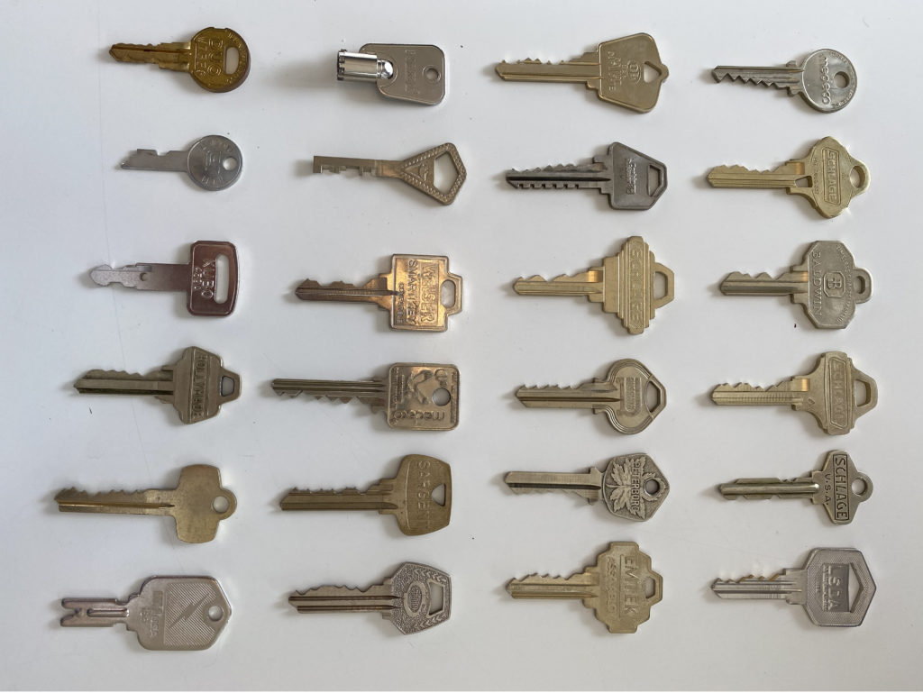 Collection of various metal keys on display.